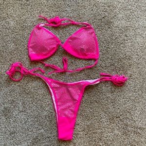 Woman’s neon pink bikini